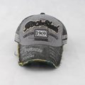 Detailed close-up of distressed vintage 1969 baseball cap with 3D rock shank embroidery - Adjustable / Dark Gray