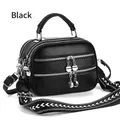 Detail of black pebbled leather crossbody bag with three zippers and patterned wide strap - Black