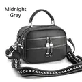 Midnight grey crossbody bag with pebble grain leather texture and woven shoulder strap - Midnight Gray