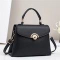 Elegant black pebbled leather handbag for women with golden hardware and adjustable strap - Black