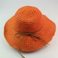 Bright orange raffia sun hat with wide brim and decorative brown ribbon bow detail - Orange