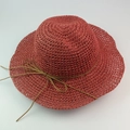 Wide brim raffia straw sun hat in brick red with a delicate brown bow ribbon tie - Burgundy