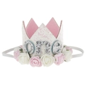 Close-up of white glitter crown with pink roses and silver one text for baby birthday - White Crown Letter ONE Pink White Flowers