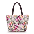 Floral canvas tote bag featuring pink roses and dark brown braided round handles - Off White