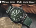 Primer plano de un reloj deportivo militar con esfera verde y correa de cuero sobre roca - Verde