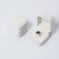 Elegant cream white velvet ring jewelry box with a soft square shape for storage - Off-white