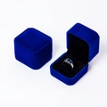 Royal blue velvet square jewelry box shown open and closed with a sapphire ring inside - Blue