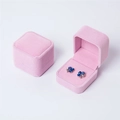 Pink velvet jewelry box with blue clover stud earrings shown in open and closed views - Pink