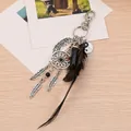 Detail of dream catcher keychain with yin yang charm, black feathers and crystal on wood - Style 3