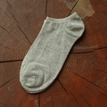 Light grey ribbed low-cut invisible cotton socks for men on a natural wood background - One Size / Light Gray