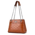 Brown bow embossed tote bag with silver chain strap and polished leather finish - Earthy Yellow