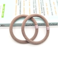 Pair of coffee brown knitted elastic hair scrunchies with purple square plastic buckles - Two-Piece Set / Light Gray