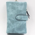 Detail of blue matte wallet featuring metal ring and secure snap button closure - Light Blue