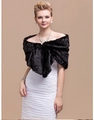 Elegant black faux fur shawl for women evening wear paired with a white formal wedding dress - Black