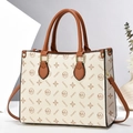 Chic cream leather tote bag with monogram print and brown top handles on geometric background - Beige With Yellow