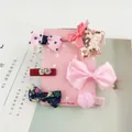 Detail showing five assorted cute hair clips for girls featuring bows and plush balls - Sequined Star 6-Piece Set