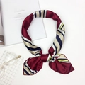Elegant satin square scarf with colorful stripes tied in a knot on a fashion magazine - Red and Yellow