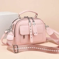 Pink PU leather shoulder bag with dual flap pockets and V-pattern knit wide strap - Pink