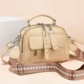 Beige faux leather handbag with utility pockets and patterned woven shoulder strap - Apricot