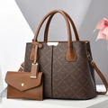 Detail view of brown monogram tote bag set with high-quality gold-tone hardware - Coffee & Khaki