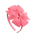 Pink grosgrain ribbon bow headband for girls featuring a large knot on a slim band - Coral Pink