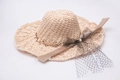Detailed macro view of the wave-brimmed straw hat featuring white pearls and black mesh veil - M(56-58cm) / Pink