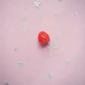 Detailed close-up of a resin red strawberry charm with textured surface for DIY crafts - 3D Strawberry Small 1.1x1.2cm