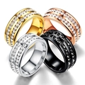 Detailed macro view of four metallic rings with double row gemstone inlay in various finishes - US 6 / Steel