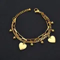 Golden double-layer stainless steel bracelet featuring heart pendants and metal beads - Gold