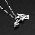 Detail of silver dumbbell pendant and plaque engraved with STRONG not skinny text - STRONG not skinny Dumbbell