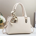 Elegant cream-white crossbody handbag with leather texture and silk scarf handle detail - Off-white