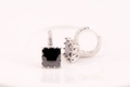 Macro view of square black gemstone hoop earrings with silver zircon pavé setting - Square / Black
