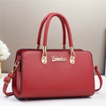 Elegant red leather handbag for women featuring a top handle and luxury gold hardware - Red