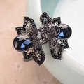 Deep blue crystal hair claw clip with dark metal hollow design for women's hairstyling - Lotus / Gunmetal Blue