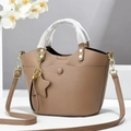 Elegant taupe litchi grain handbag with detachable shoulder strap and star charm accessory - Khaki