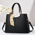 Fashionable black lychee textured handbag with gold hardware and silk scarf decoration - Black