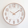 Modern 12-inch round wall clock with rose gold 3D numbers and silent quartz movement - Rose Gold