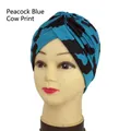 Peacock blue cow print turban hat with twist knot design for yoga and street style - One Size / Peacock Blue Cow Print