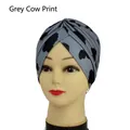 Chic cow print grey turban hat for women and men featuring criss-cross pleated design - One Size / Grey Cow Print
