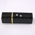 Macro shot of two transparent silicone earring backs on a black and gold decorative stand - Clear Silicone Earring Backs