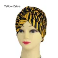 Yellow zebra print beanie hat for yoga or hip-hop with a stylish front cross design - One Size / Yellow Zebra