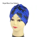 Royal blue beanie turban with black cow print pattern and stylish front cross knot - One Size / Royal Blue Cow Print
