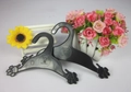Detail of two black plastic pet hangers with paw-shaped hooks and Feipet brand logo - Small (17.5*12cm) / Black