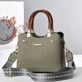 Olive twill tote bag with amber resin handles and wide patterned shoulder strap - Green