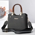 Dark grey canvas crossbody bag with amber resin handles and wide patterned strap - Gray