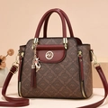 Elegant wine red and brown crossbody bag with logo pattern and cat charm - Coffee & Red