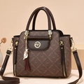 Dark brown vintage monogram crossbody bag with twin handles and a cat tassel charm - Coffee