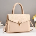 Detail of apricot tote bag with crocodile pattern leather and gold metal buckle - Apricot