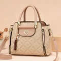 Brown leather handbag with brand logo print and cat tassel pendant in variant view - Khaki