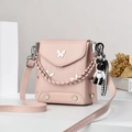 Pink mini crossbody phone bag with silver butterfly detail and cute bear charm - Pink